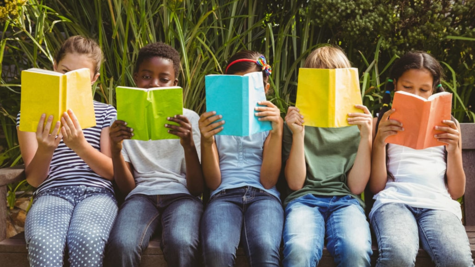 photo of five children reading