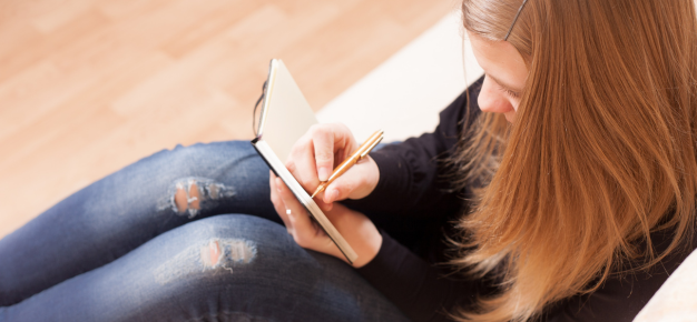 photo of a teen writing