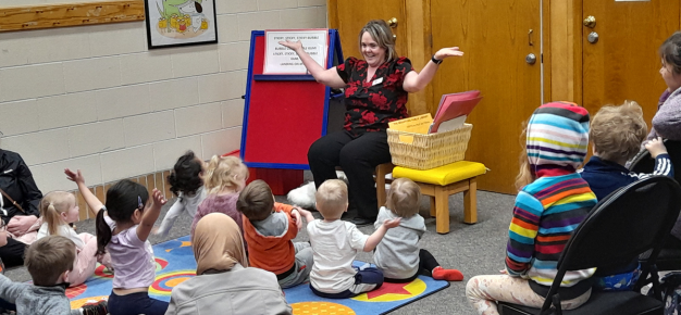 photo of library staff telling stories to children