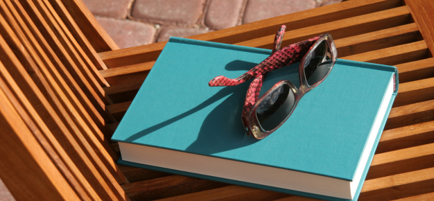 photo of a pair of sunglasses on a book
