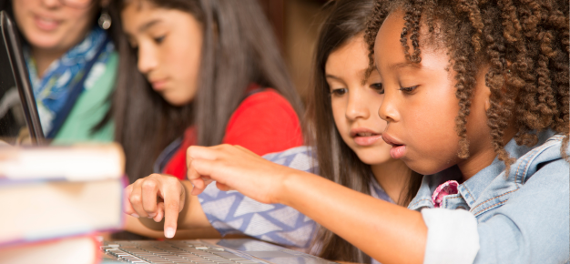 photo of two girls coding
