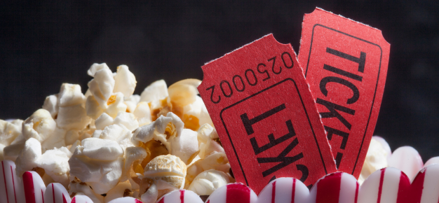 photo of movie tickets and popcorn